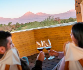 Couple enjoying chilean wine at Explora Atacama.