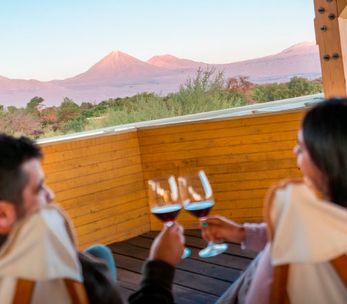 Couple enjoying chilean wine at Explora Atacama.