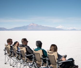 People relaxing Uyuni salt flats