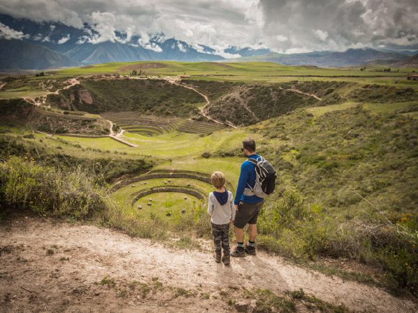 A kid with his father enjoying the views of Moray in Valle Sagrado, Perú