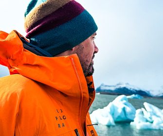 Explora guide gazing at floating icebergs on Jökulsárlón Glacier Lagoon during an Iceland Winter expedition