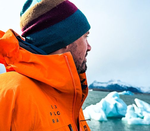 Explora guide gazing at floating icebergs on Jökulsárlón Glacier Lagoon during an Iceland Winter expedition